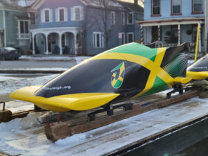 Jamaican bobsled painted with flag colors