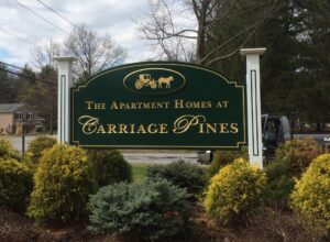 Carriage Pines apartment homes green entrance sign