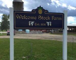 Welcome Stock Farm sign with silo