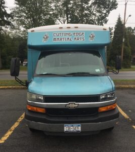 Front of Chevrolet Cutting Edge Martial Arts van