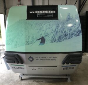 Gore Mountain gondola cabin with skier graphic