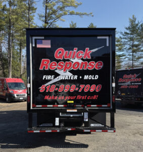 Rear of Quick Response restoration service truck