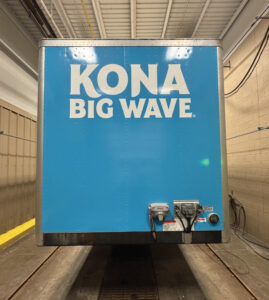Blue trailer rear with KONA BIG WAVE logo
